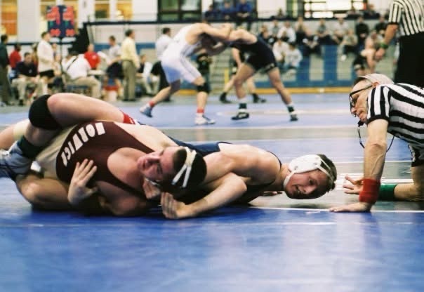 Wrestling competition mat control